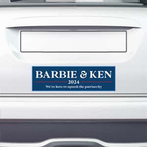 Barbie and Ken bumper sticker on the bumper of a white car