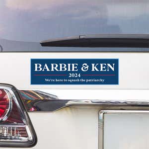 Barbie and Ken bumper sticker above a white car's tail light
