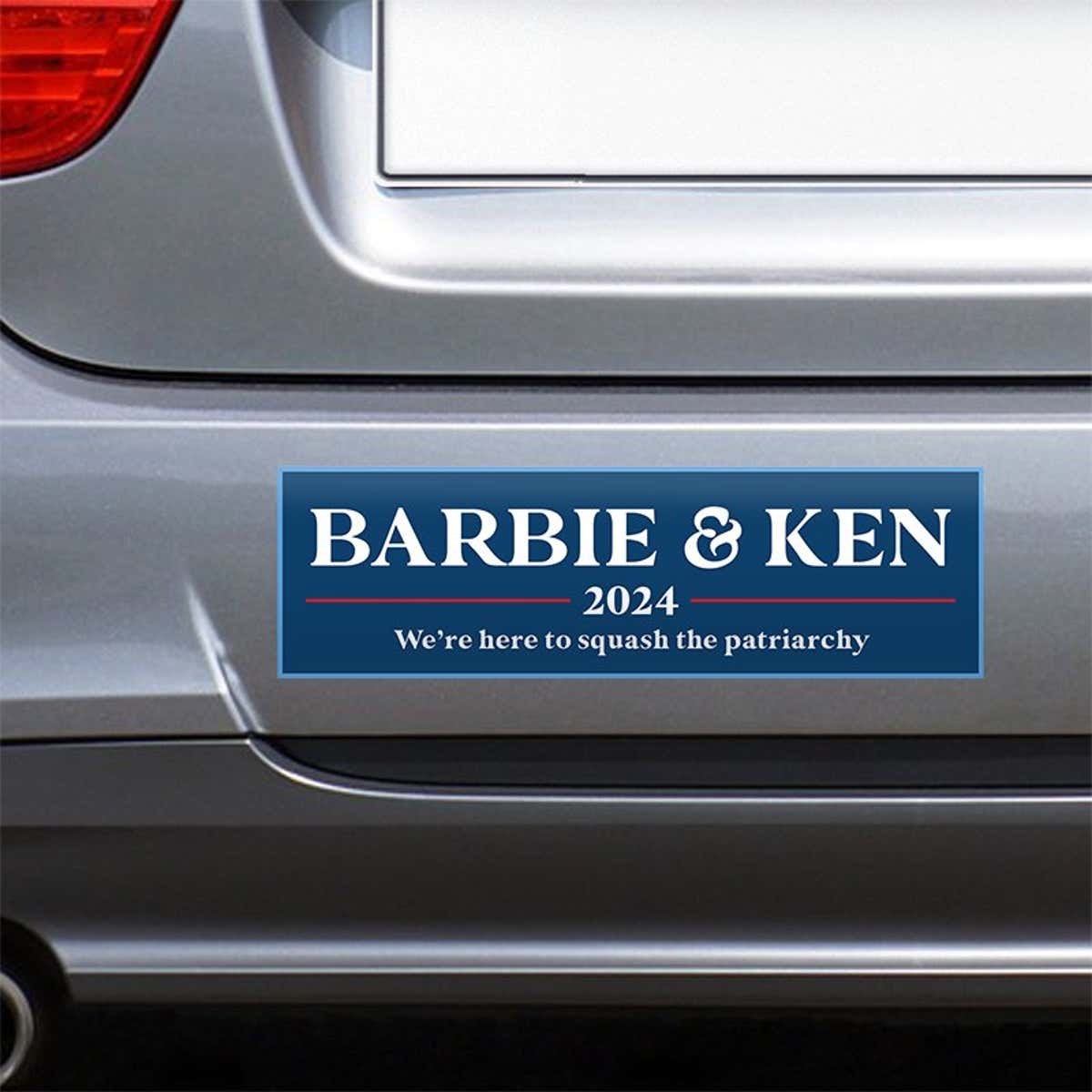 Barbie and Ken bumper sticker on the bumper of a gray car