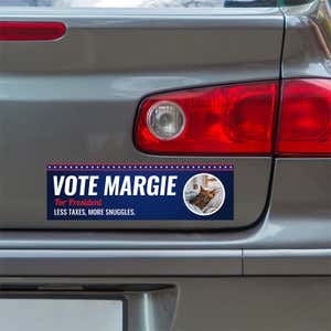 Custom Round Photo Political Bumper Sticker below a gray car's tail light