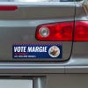 Custom Round Photo Political Bumper Sticker below a gray car's tail light