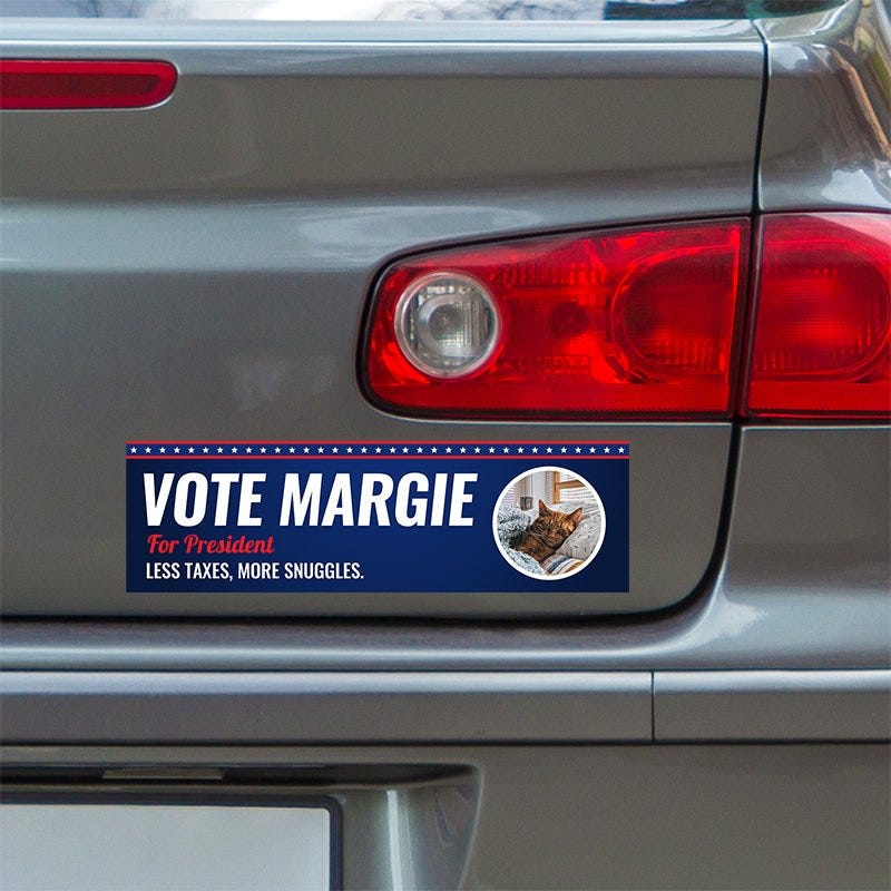 Custom Round Photo Political Bumper Sticker below a gray car's tail light