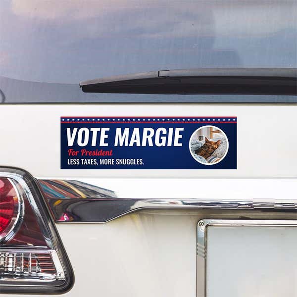 Custom Round Photo Political Bumper Sticker above a white car's tail light