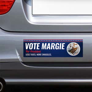Custom Round Photo Political Bumper Sticker on the bumper of a gray car
