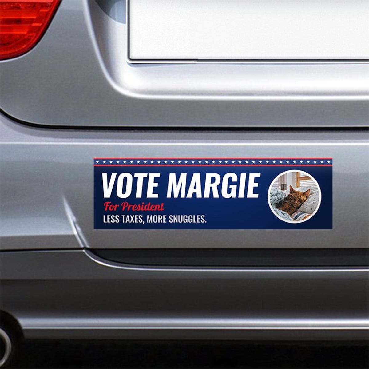 Custom Round Photo Political Bumper Sticker on the bumper of a gray car