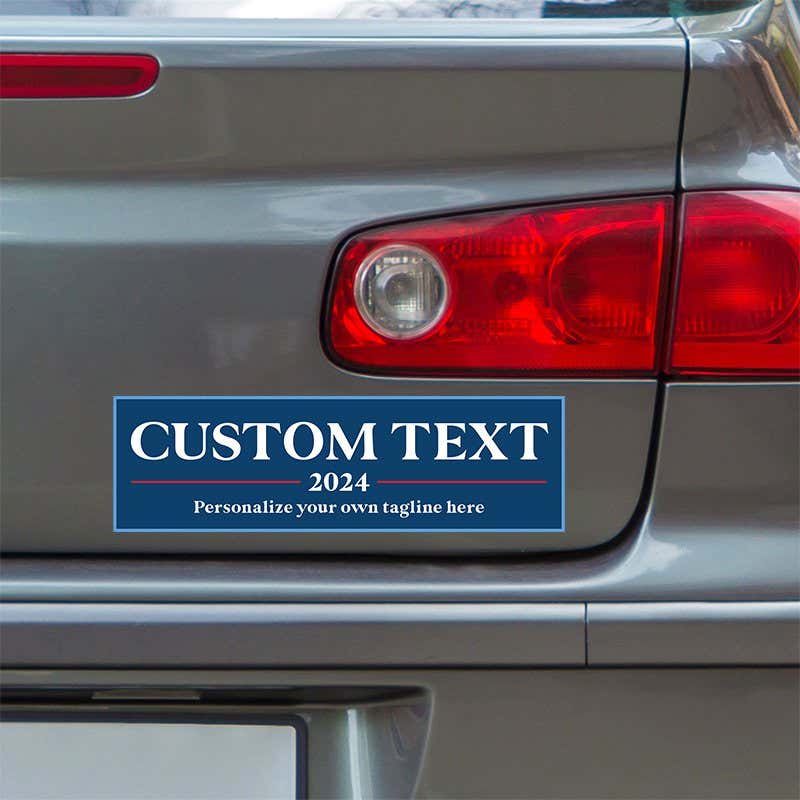 Custom Text Political Bumper Sticker below a gray car's tail light