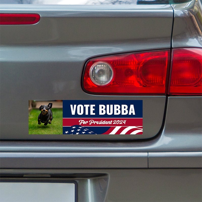 Custom Photo Political Bumper Sticker below a gray car's tail light