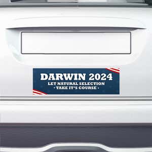 Darwin Political Bumper Sticker on the bumper of a white car