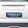 Darwin Political Bumper Sticker on the bumper of a white car