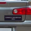 Literally Anyone Else Bumper Sticker below a gray car's tail light