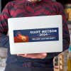 Giant Meteor Bumper Sticker on a laptop