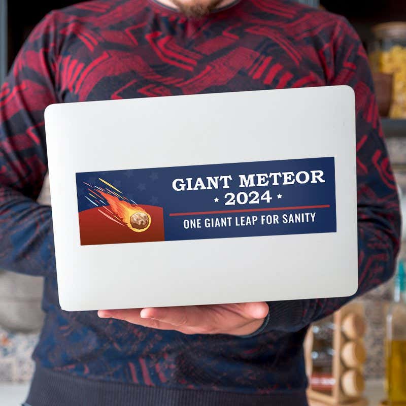 Giant Meteor Bumper Sticker on a laptop