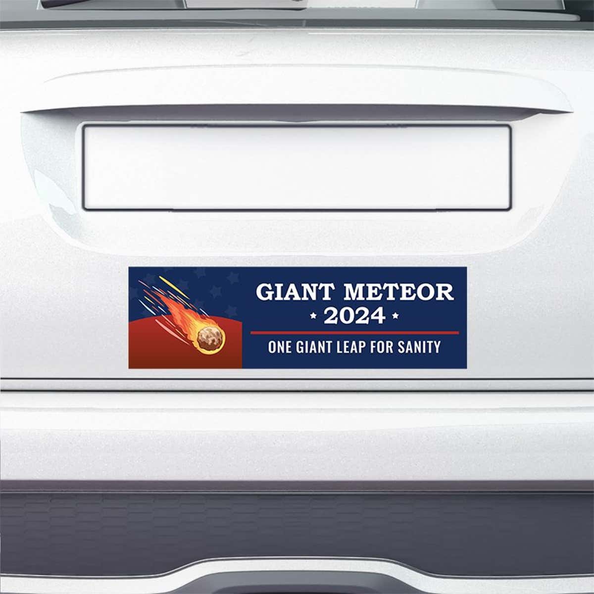 Giant Meteor Bumper Sticker on the bumper of a white car