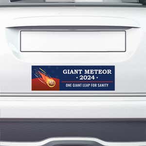 Giant Meteor Bumper Sticker on the bumper of a white car