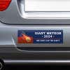 Giant Meteor Bumper Sticker on the bumper of a gray car