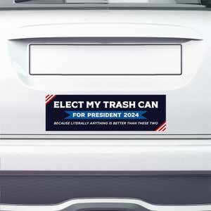 Elect My Trash Can Bumper Sticker on the bumper of a white car