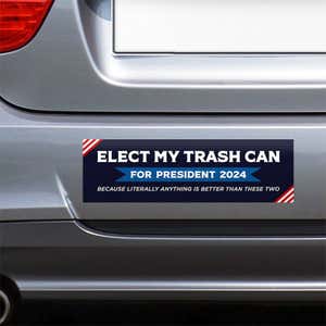 Elect My Trash Can Bumper Sticker on the bumper of a gray car
