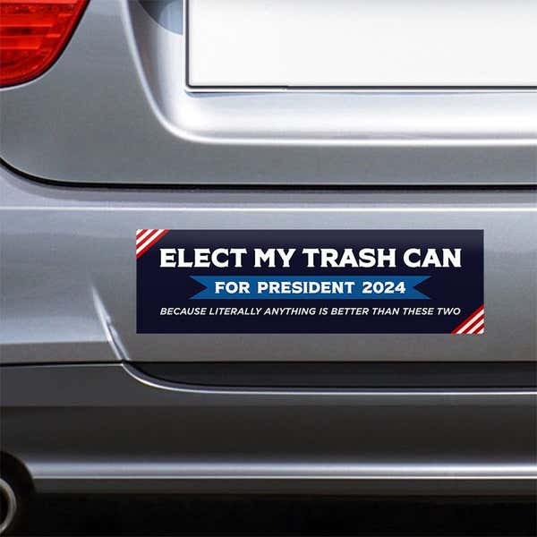 Elect My Trash Can Bumper Sticker on the bumper of a gray car