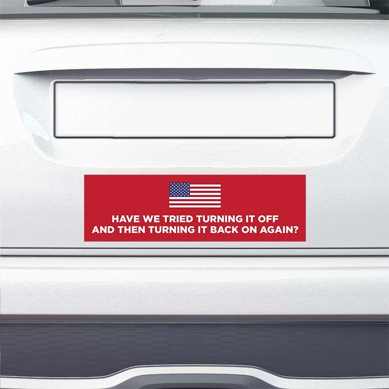 American Flag Funny Political Bumper Sticker on the bumper of a white car