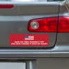 American Flag Funny Political Bumper Sticker below a gray car's tail light