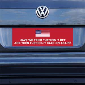 American Flag Funny Political Bumper Sticker on a gray car