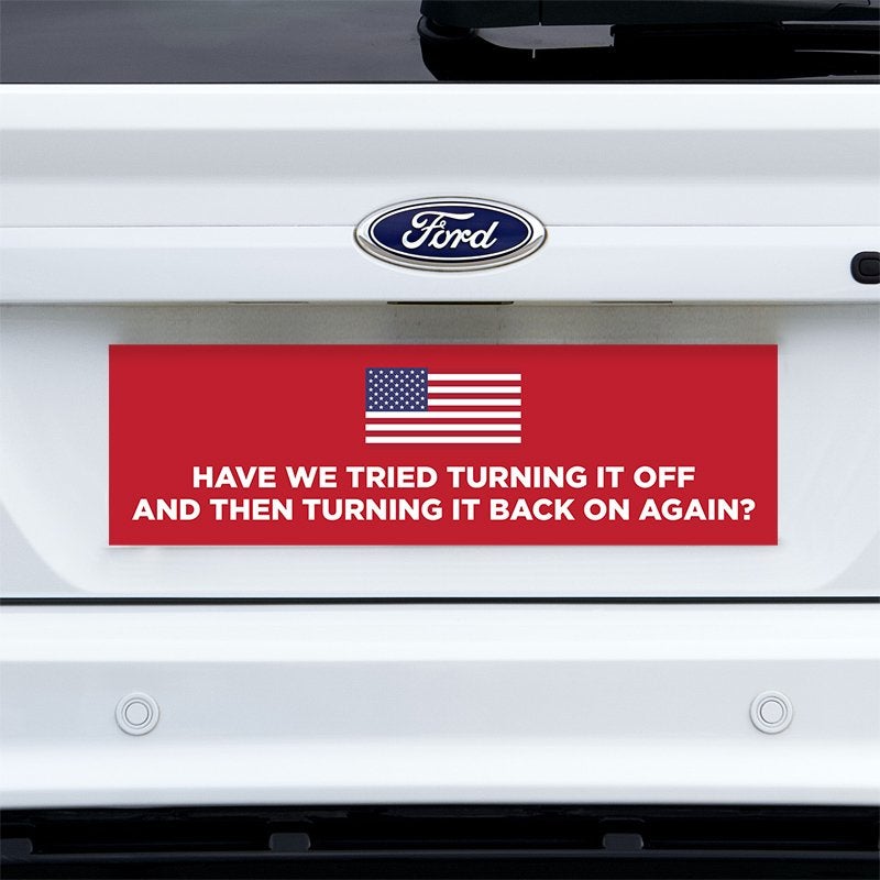 American Flag Funny Political Bumper Sticker on a white truck