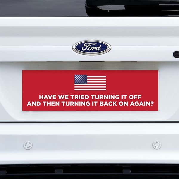 American Flag Funny Political Bumper Sticker on a white truck