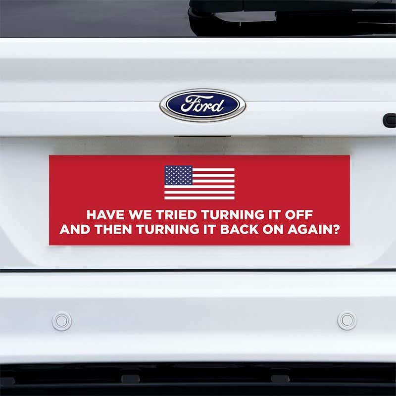 American Flag Funny Political Bumper Sticker on a white truck