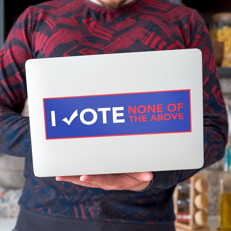 None of the Above Political Bumper Sticker on a laptop