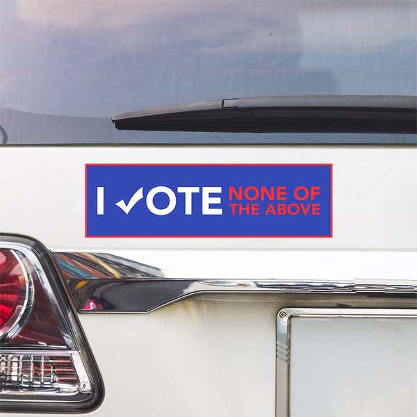 None of the Above Political Bumper Sticker above a white car's tail light