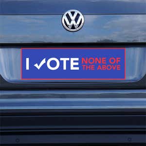 None of the Above Political Bumper Sticker on a gray car