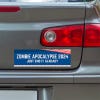 Zombie Apocalypse Political Bumper Sticker below a gray car's tail light