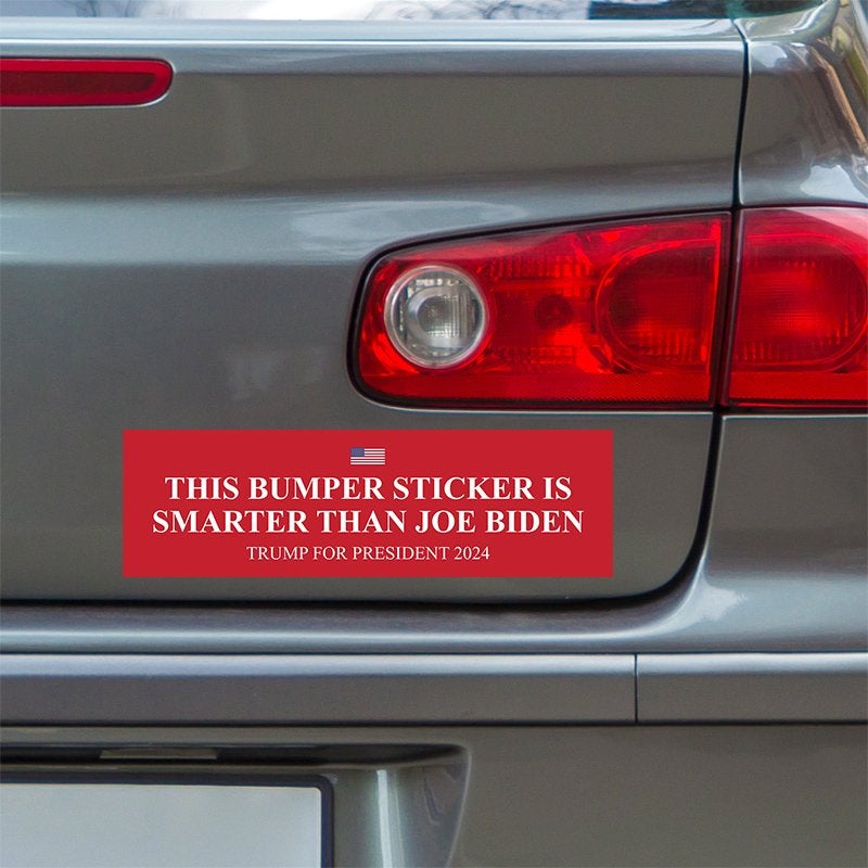 Smarter Than Biden Bumper Sticker below a gray car's tail light