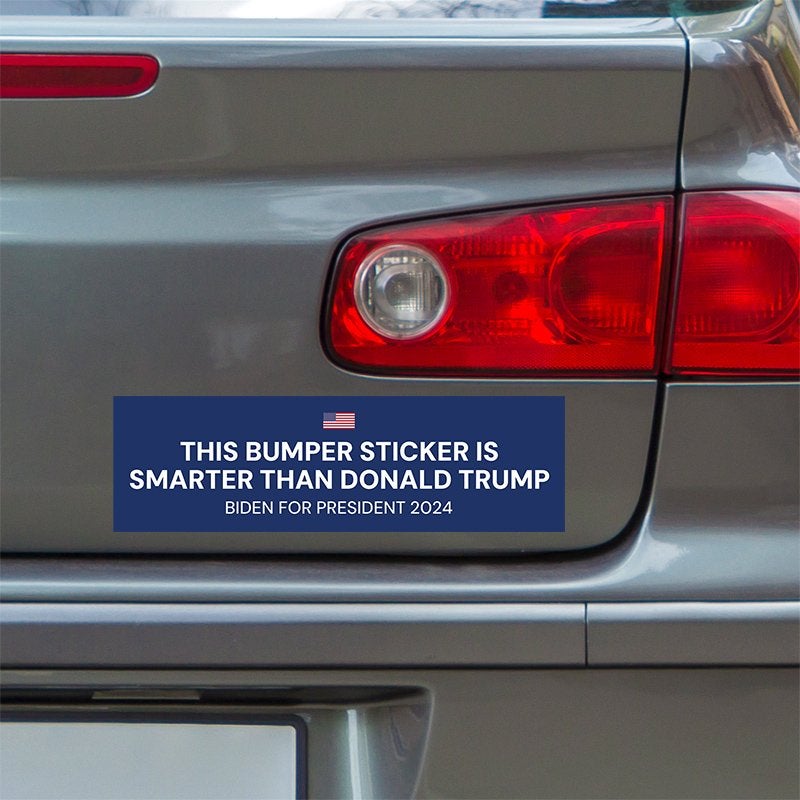 Smarter Than Trump Bumper Sticker below a gray car's tail light
