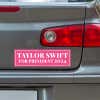 Taylor Swift for President Bumper Sticker below a gray car's tail light