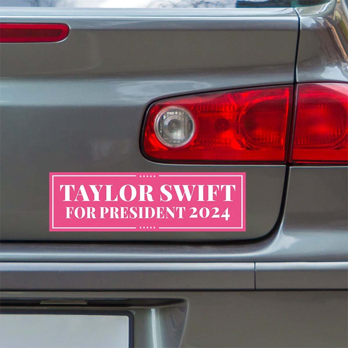 Taylor Swift for President Bumper Sticker below a gray car's tail light
