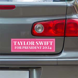 Taylor Swift for President Bumper Sticker below a gray car's tail light