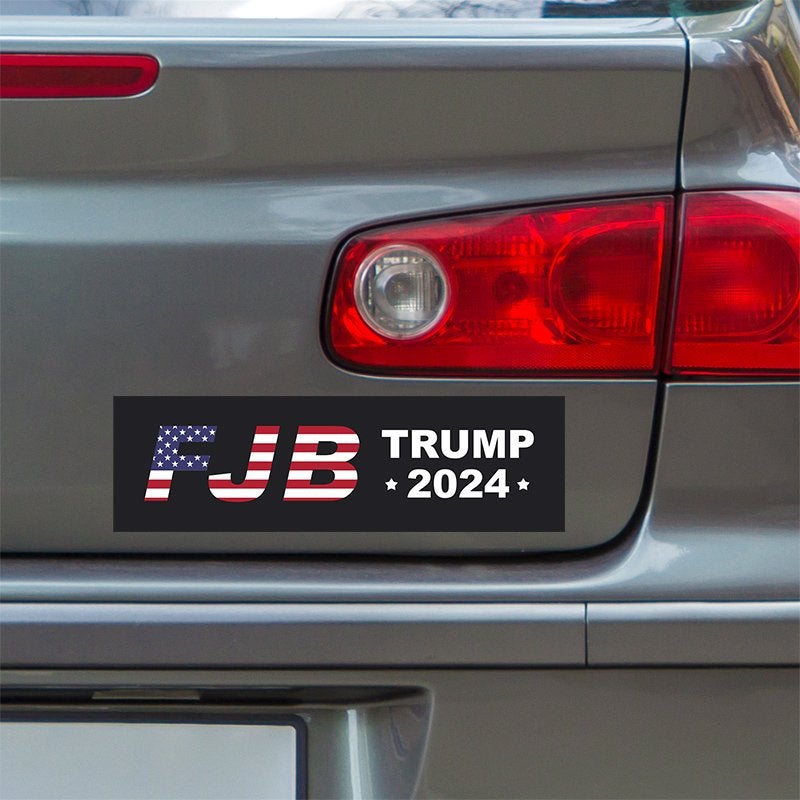 FJB Bumper Sticker below a gray car's tail light