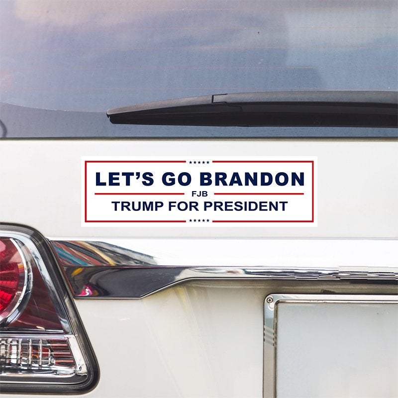 Let's Go Brandon Bumper Sticker above a white car's tail light
