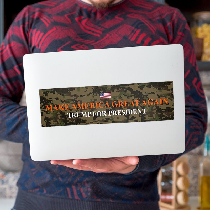 Camo MAGA Bumper Sticker on a laptop