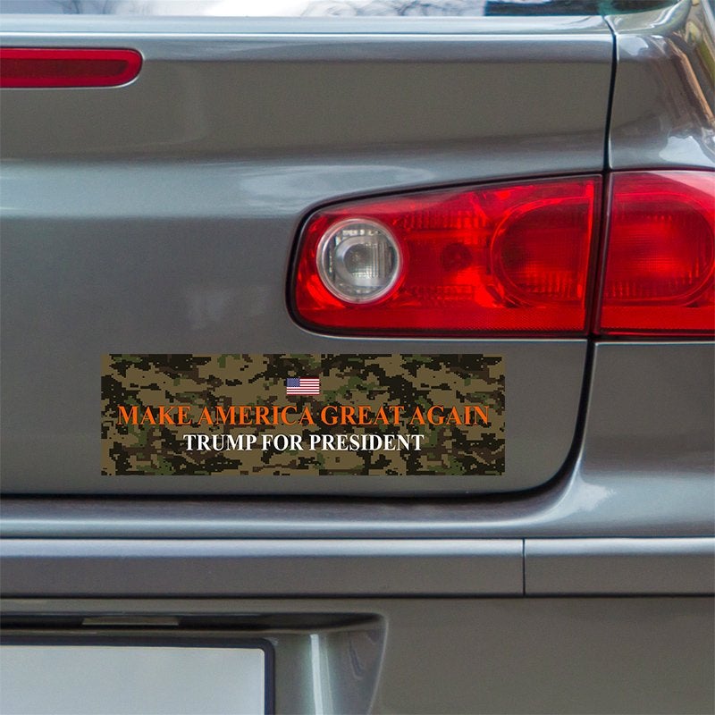 Camo MAGA Bumper Sticker below a gray car's tail light