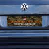 Camo MAGA Bumper Sticker on a gray car
