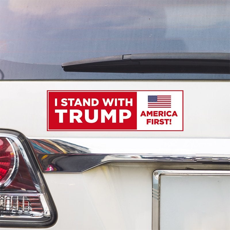 I Stand with Trump Bumper Sticker above a white car's tail light