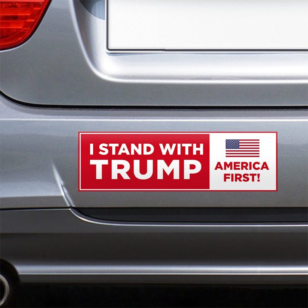 I Stand with Trump Bumper Sticker on the bumper of a gray car