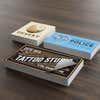 Three stacks of custom vinyl stickers with varying business designs
