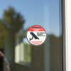 A vinyl sticker for 24-hour security surveillance on a storefront window