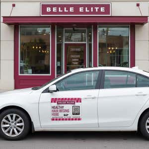 Pink and white custom car magnet for hair salon on white car