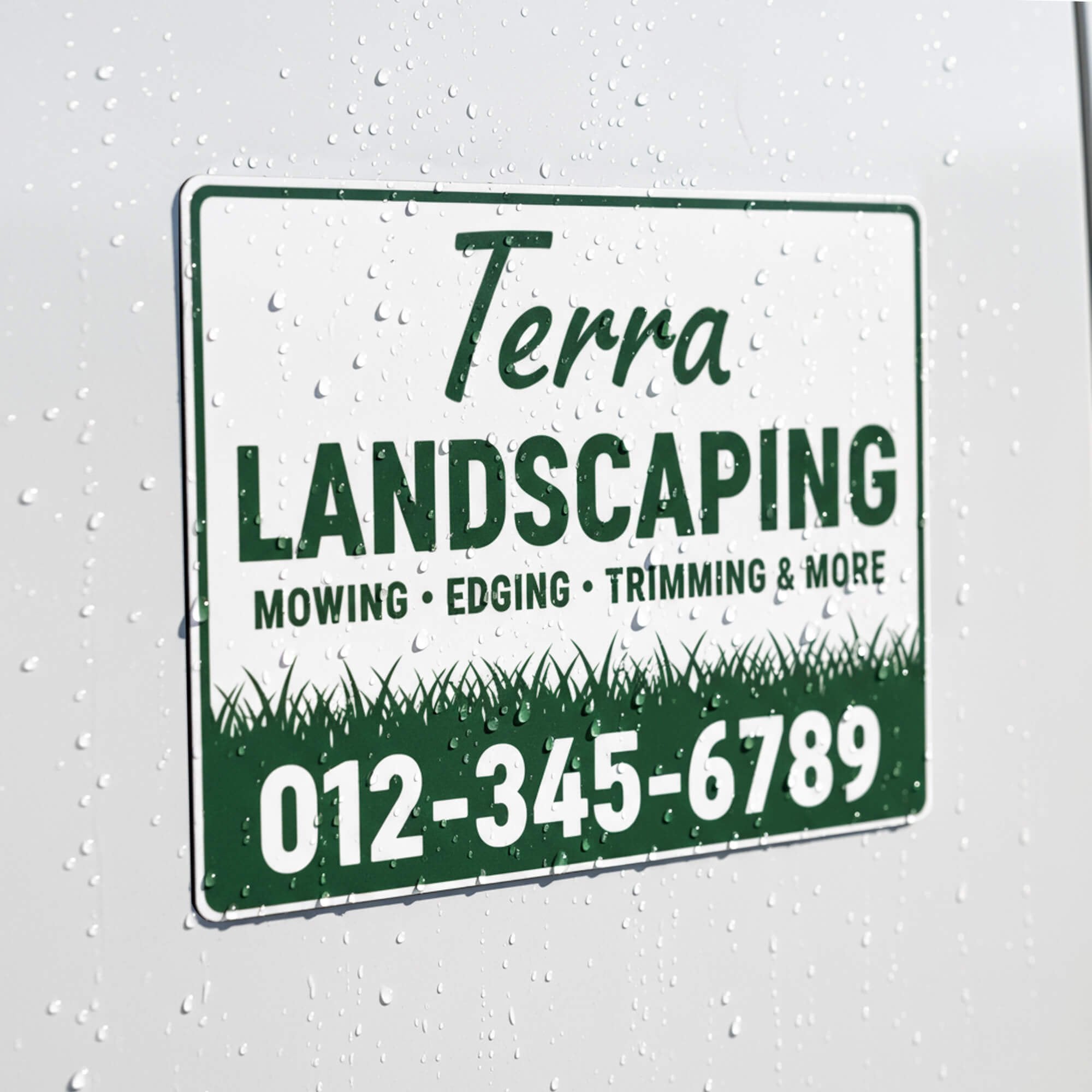 A custom car magnet with border for a landscaping business
