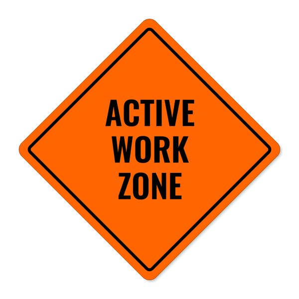 Orange aluminum sign with the message of an active work zone