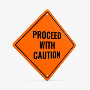 Orange aluminum sign with the message to proceed with caution 